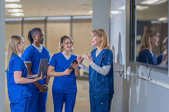 Four nurses looking at camera