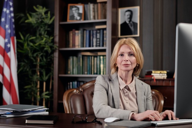 School principal sitting at desk