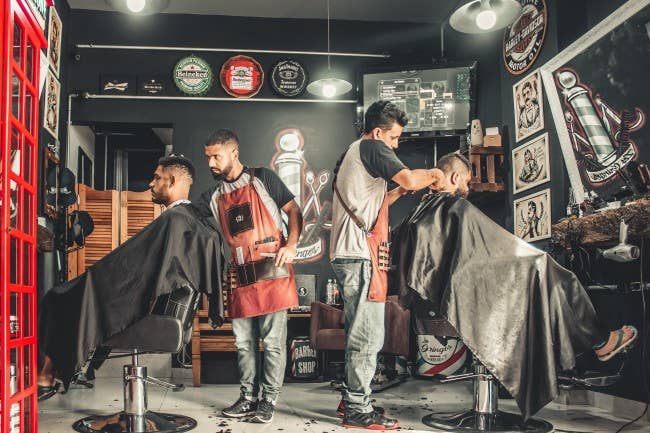 barber cutting a mans hair